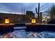 Evening scene in a hot tub, with lit decorative lanterns and landscape view at 1646 N Channing --, Mesa, AZ 85207