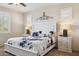 Main bedroom with white furniture, carpeted floors, and decor accents at 1646 N Channing --, Mesa, AZ 85207