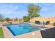 A stunning backyard pool featuring a spa, lounge chairs, and a peaceful spot for relaxation at 1646 N Channing --, Mesa, AZ 85207