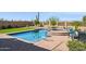 Beautiful backyard pool area with a spa, desert landscaping, and brick pavers at 1646 N Channing --, Mesa, AZ 85207