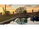 Reflective pool at sunset with desert landscaping, offering a tranquil oasis at 1646 N Channing --, Mesa, AZ 85207
