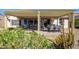 Large covered patio featuring dining and seating areas at 16495 W Monteverde Ln, Surprise, AZ 85374