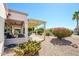 Landscaped backyard with patio, pergola and desert flora at 16495 W Monteverde Ln, Surprise, AZ 85374
