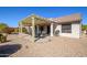 Relaxing backyard patio area featuring a pergola and outdoor dining set at 16495 W Monteverde Ln, Surprise, AZ 85374