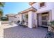 Inviting front entrance with decorative security door and paved patio area, adding curb appeal at 16495 W Monteverde Ln, Surprise, AZ 85374