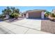 Lovely single-story home with a two-car garage and low maintenance desert landscaping at 16495 W Monteverde Ln, Surprise, AZ 85374