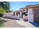 Charming single-story home featuring a gated front yard and a well-manicured desert landscape at 16495 W Monteverde Ln, Surprise, AZ 85374