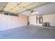 Spacious garage with epoxy flooring and built-in storage cabinets at 16495 W Monteverde Ln, Surprise, AZ 85374
