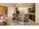 Open-concept kitchen with bar seating and granite countertops, perfect for entertaining at 16495 W Monteverde Ln, Surprise, AZ 85374