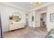 Spacious bedroom with hard wood floors and a decorative dresser at 17336 W Crawfordsville Dr, Surprise, AZ 85388