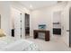 Bedroom showcasing a desk, closet, and bathroom at 17336 W Crawfordsville Dr, Surprise, AZ 85388