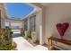 Beautiful courtyard with rock landscaping, desert plants, and stylish décor leading to the entrance at 17336 W Crawfordsville Dr, Surprise, AZ 85388
