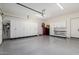 This garage has an epoxy floor and organized storage at 17336 W Crawfordsville Dr, Surprise, AZ 85388