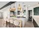 Modern kitchen with a large island, stainless steel appliances, and a walk-in pantry at 17336 W Crawfordsville Dr, Surprise, AZ 85388