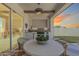 Outdoor kitchen and dining area with large grill, pizza oven, and lush views at 17336 W Crawfordsville Dr, Surprise, AZ 85388
