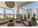 Inviting outdoor space with stylish seating, desert plants, and shade for relaxed living at 17336 W Crawfordsville Dr, Surprise, AZ 85388