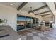Inviting outdoor space features a complete outdoor kitchen, dining area, and pool view from the sliding glass doors at 17336 W Crawfordsville Dr, Surprise, AZ 85388