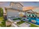 This backyard features a pool, seating area, and well-maintained landscaping at 17336 W Crawfordsville Dr, Surprise, AZ 85388