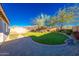 Turf backyard with professional landscaping at 17563 W Summit Dr, Goodyear, AZ 85338