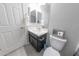 Well-lit bathroom featuring a vanity with storage and a matching framed mirror at 17563 W Summit Dr, Goodyear, AZ 85338