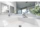 Modern bathroom featuring a white countertop and dual sink with chrome faucet at 17563 W Summit Dr, Goodyear, AZ 85338