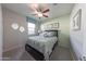 Charming bedroom features a comfy bed, stylish decor, and a complementary wall color at 17563 W Summit Dr, Goodyear, AZ 85338