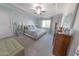 Spacious bedroom featuring a king bed with decorative pillows and a ceiling fan at 17563 W Summit Dr, Goodyear, AZ 85338