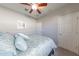 Bright bedroom with soft bedding, decorative pillows, and a peaceful ambiance for relaxation at 17563 W Summit Dr, Goodyear, AZ 85338