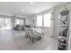 Open dining area featuring a glass table, stylish chairs, and lots of natural light from sliding glass doors at 17563 W Summit Dr, Goodyear, AZ 85338