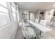 Bright dining area with a glass table, stylish chairs, and elegant decor, perfect for Gathering meals at 17563 W Summit Dr, Goodyear, AZ 85338