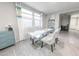 Bright dining area with a glass table, stylish chairs, and elegant decor, perfect for Gathering meals at 17563 W Summit Dr, Goodyear, AZ 85338