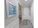 Well-lit entryway featuring a decorative rug, a coat closet, and views of a sitting room at 17563 W Summit Dr, Goodyear, AZ 85338