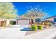 Beautiful single-story home boasts manicured landscaping and a two car garage in a friendly neighborhood at 17563 W Summit Dr, Goodyear, AZ 85338