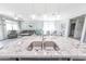 Open concept kitchen with a view of the living area, complete with stainless steel sink at 17563 W Summit Dr, Goodyear, AZ 85338
