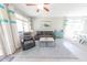 Cozy living room featuring comfortable seating, modern decor, and ample natural light at 17563 W Summit Dr, Goodyear, AZ 85338
