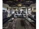 Spacious lobby featuring high ceilings, exposed wood beams, modern furniture, and a cozy fireplace at 17563 W Summit Dr, Goodyear, AZ 85338