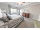 Comfortable main bedroom with large window, dresser, and calm colors offering a relaxing retreat at 17563 W Summit Dr, Goodyear, AZ 85338