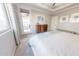 Serene main bedroom with an access door, dresser, and plenty of natural light from the sliding glass door at 17563 W Summit Dr, Goodyear, AZ 85338