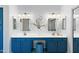 Bathroom with a double vanity, storage, and matching mirrors at 1835 E Bartlett Pl, Chandler, AZ 85249