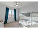 Bedroom featuring a bunk bed, window and blue curtains at 1835 E Bartlett Pl, Chandler, AZ 85249