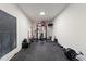 Spacious home gym with weight rack, kettle bells, rubber flooring and natural light at 1835 E Bartlett Pl, Chandler, AZ 85249
