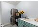 Laundry room with modern washer and dryer, sink and storage at 1835 E Bartlett Pl, Chandler, AZ 85249
