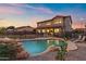 Beautiful backyard with a swimming pool, complemented by lounge chairs and a well-kept lawn at 1835 E Bartlett Pl, Chandler, AZ 85249