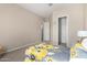 Comfortable bedroom with a large bed and ample natural light from a window at 18406 W Verbena Dr, Goodyear, AZ 85338