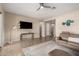 Spacious living room with contemporary furnishings, a ceiling fan, and an open layout at 18406 W Verbena Dr, Goodyear, AZ 85338
