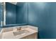 Bathroom with a blue accent wall, and a modern vanity with solid surface counters and a mirror at 1941 W Trotter Trl, Phoenix, AZ 85085