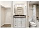 Compact bathroom featuring modern vanity with framed mirror, toilet and a tiled shower with a tub at 2 W Georgia Ave # 5, Phoenix, AZ 85013