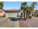 Desert landscaping with mature trees and shrubs enhances this charming home's curb appeal at 20049 N Siesta Rock Dr, Surprise, AZ 85374