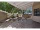 Covered back patio featuring desert landscaping and tile flooring at 2051 W Ronald Rd, Phoenix, AZ 85029