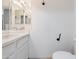 Bright bathroom with a well-lit mirror and functional fixtures at 2051 W Ronald Rd, Phoenix, AZ 85029